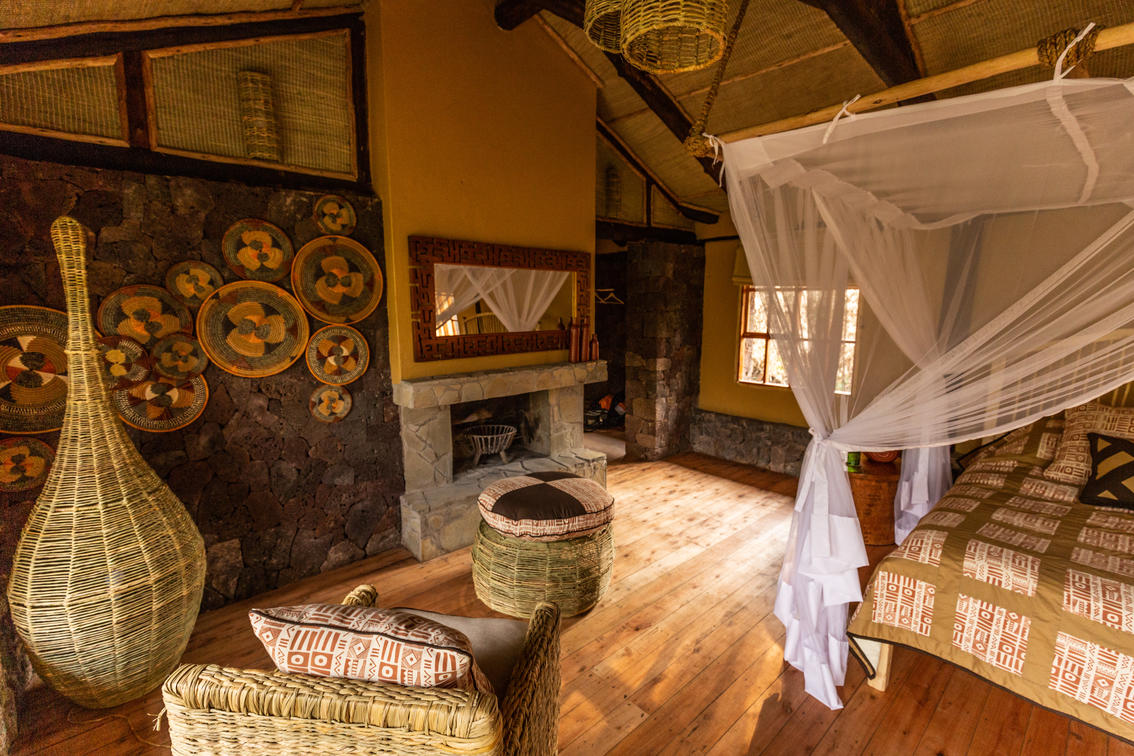 Mount Gahinga Lodge - Uganda Banda fire place in room