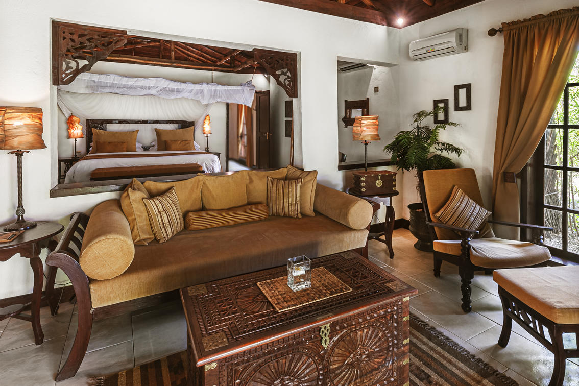 The Plams Zanzibar Two Bedroom Villa Sitting Area with Bed View